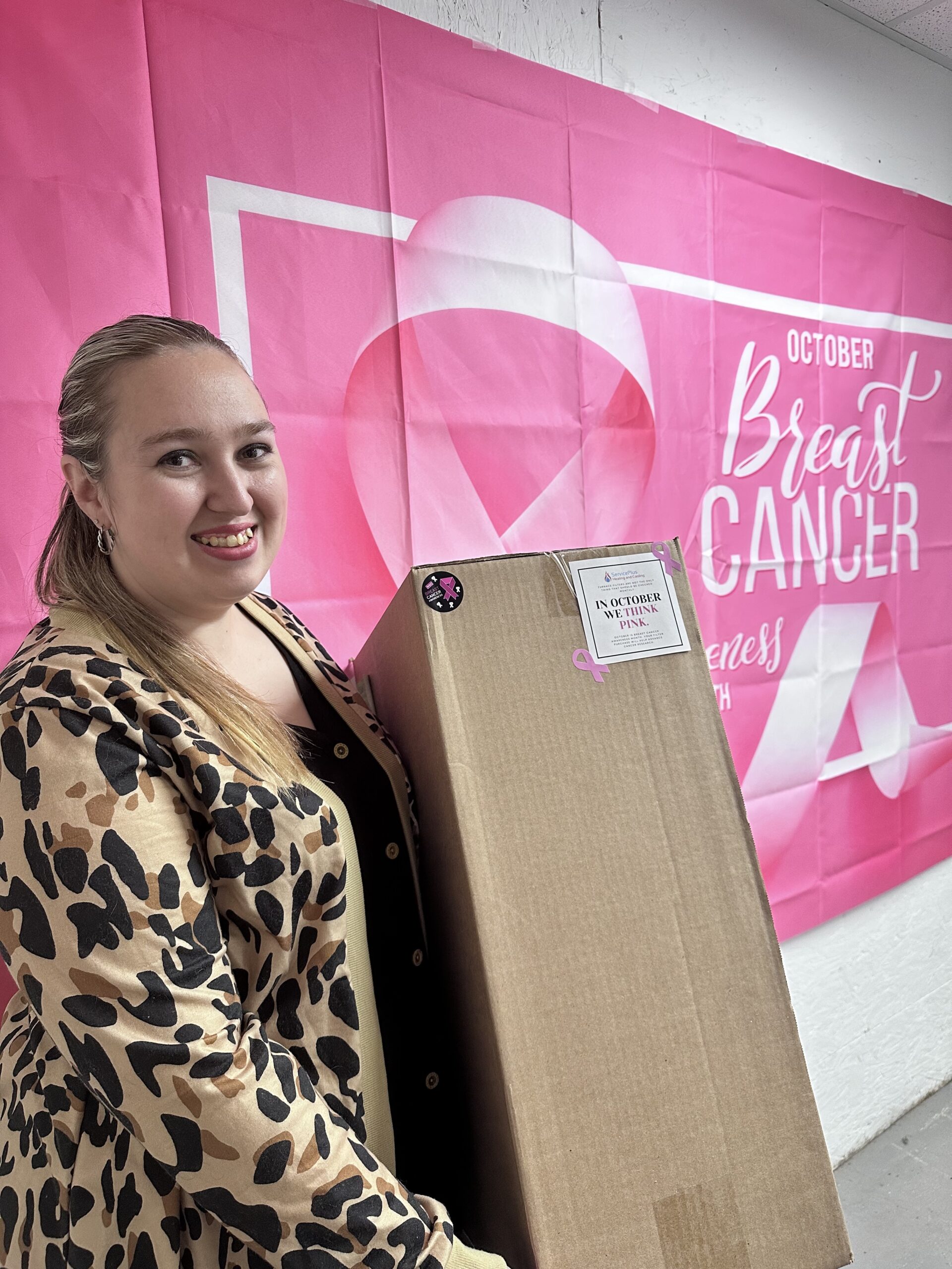 Khiana our customer service representative holding a box of campaign filters. 