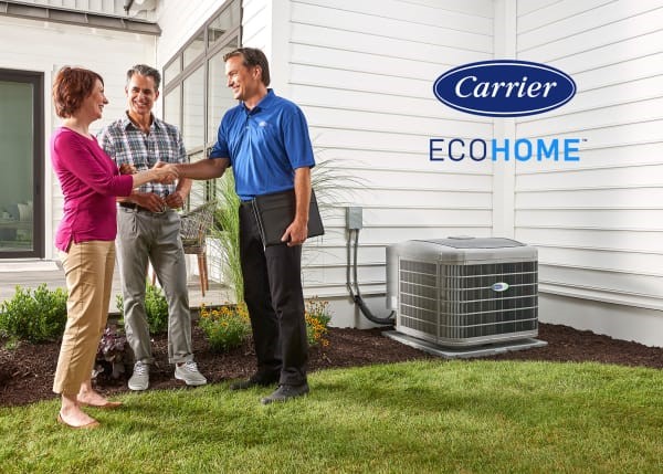 Technician shaking homeowner hand after a heat pump installation.