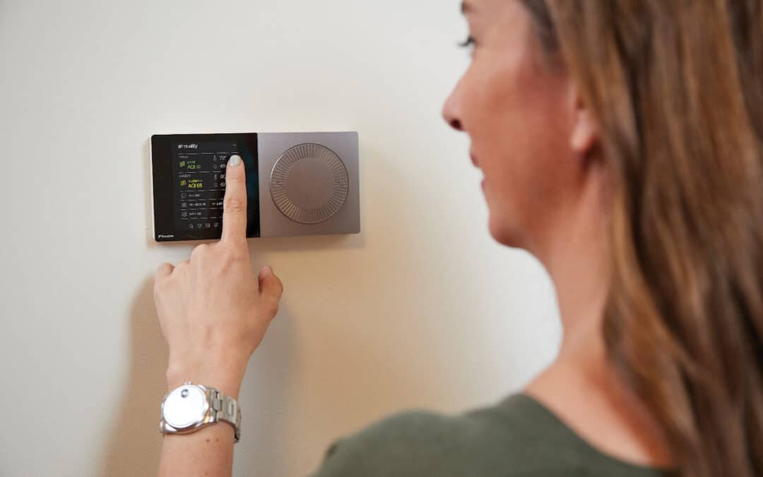 Tenant adjusting temperature on Daikin One thermostat that is connected through cloud services